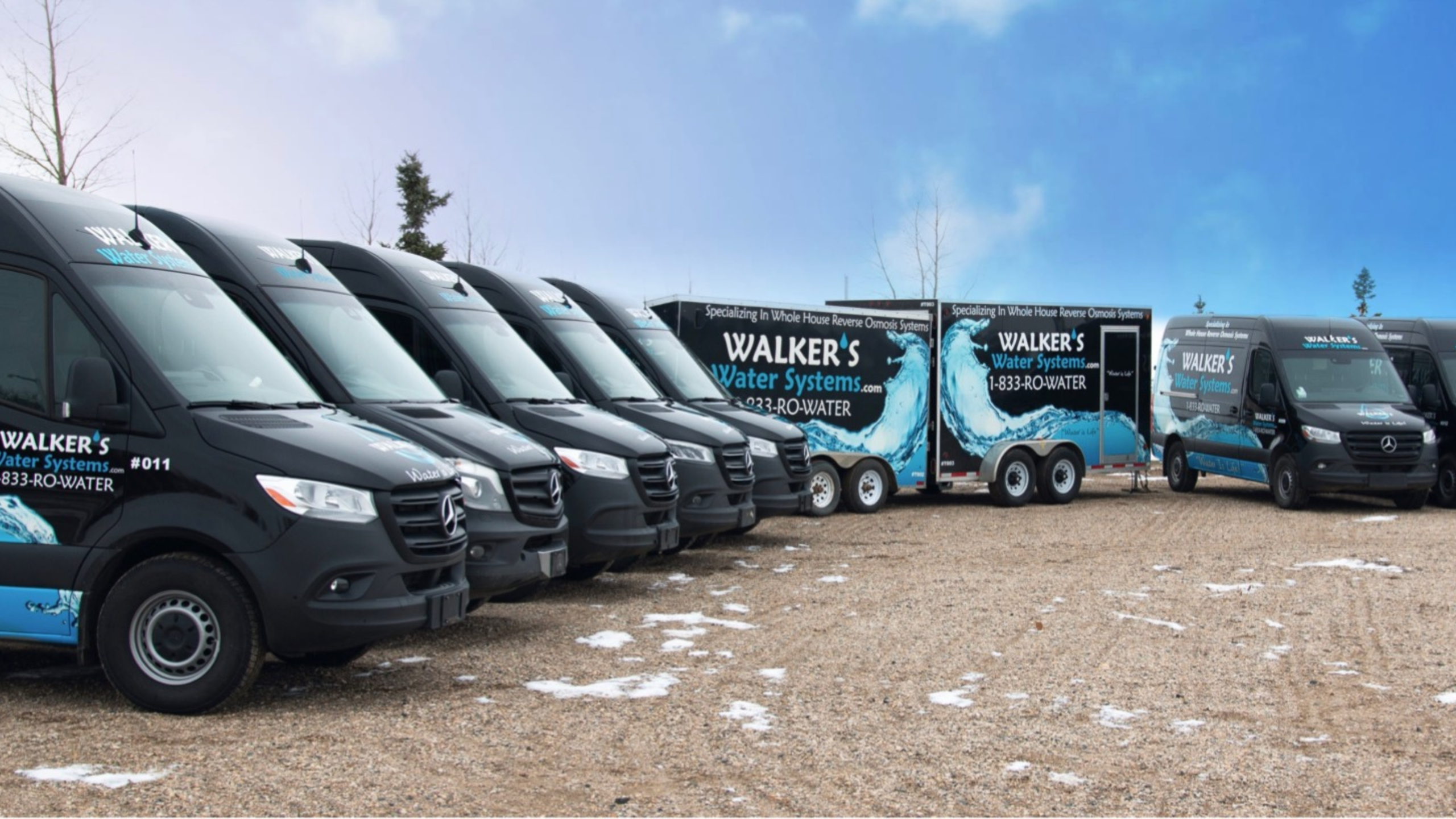 Photo of Walkers Water Fleet vehicles and Trailers with logos and water splash image on them